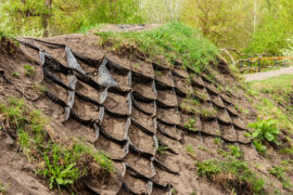 Strengthening the slope soil with volumetric geogrid. Polymer Geogrid Retaining Wall in the garden or park to protect slopes